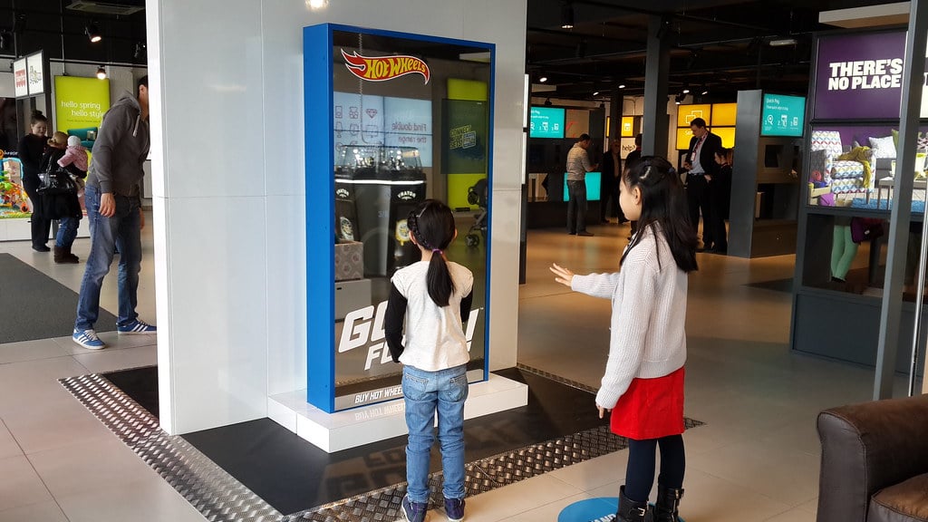 children using digital signage kiosk screen